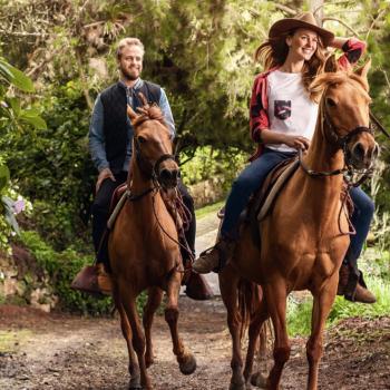 A couple enjoys nature riding. Learn about equestrian tourism in Colombia.