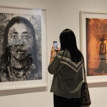 Woman visits an exhibition in a Colombian museum.